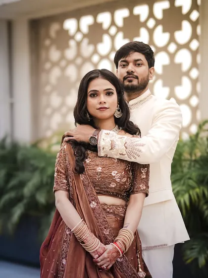 An elegant engagement portrait with the groom's arm gently around his fiancée.