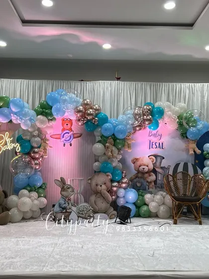 Another angle of the grand naming ceremony setup, showing the 'Baby' neon sign and custom backdrop.