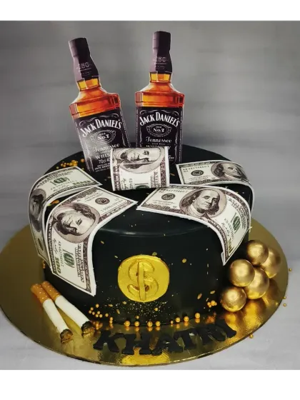 A bold cake for a Jack Daniel's fan. This black chocolate cake is decorated with edible money, cigarettes, and miniature bottle toppers for a fun adult theme.