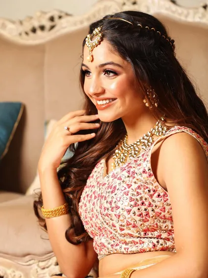 A happy, candid smile that shows the bride's joy and comfort.