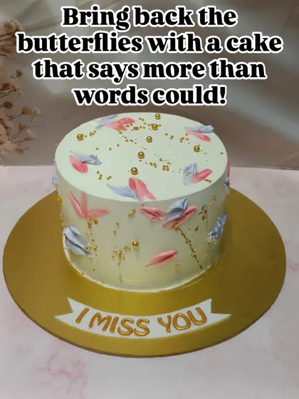 A cake that says "I Miss You" more than words can. This elegant design features a delicate butterfly motif painted with buttercream, perfect for bridging any distance.