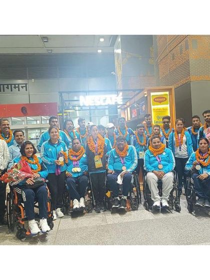 A wider shot of the celebrated para-athlete team at the airport. Seeing our patients achieve their goals on such a grand scale is a source of immense pride for our clinic.