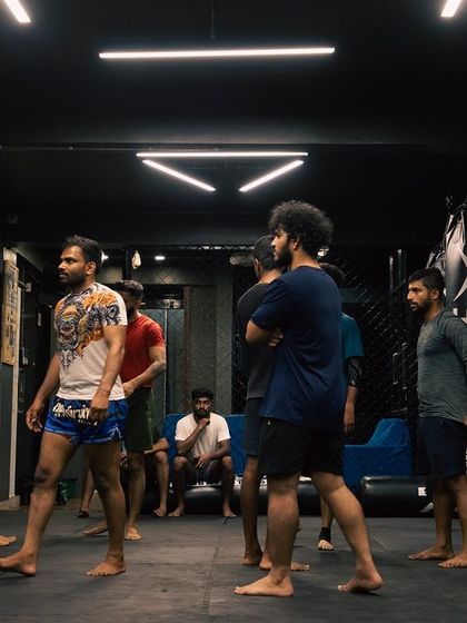 A snapshot of the gym floor, with fighters of all levels preparing for the next set of drills.