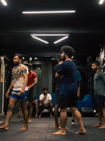 A snapshot of the gym floor, with fighters of all levels preparing for the next set of drills.