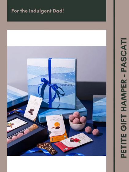 For the indulgent dad, the Petite Gift Hamper from Pascati is a dream. It features a selection of artisanal chocolates and truffles in a beautiful watercolor-themed box.