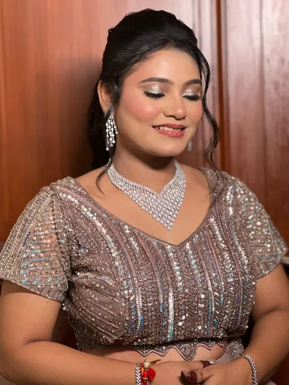 A close-up of the makeup, showing the soft shimmer on the eyelids.