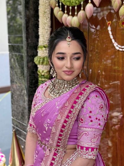 A close-up on the makeup, featuring soft-winged eyeliner and a natural lip color.