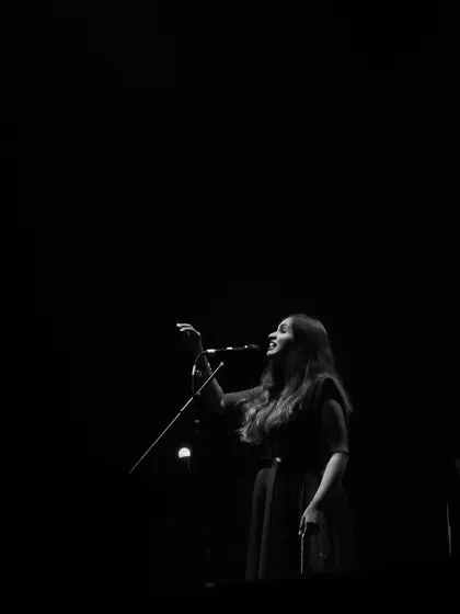 A dramatic black and white shot from my 'Vari' album release concert in Bengaluru. The single spotlight captures the solitude and focus that music requires, even when you're performing for a full house.