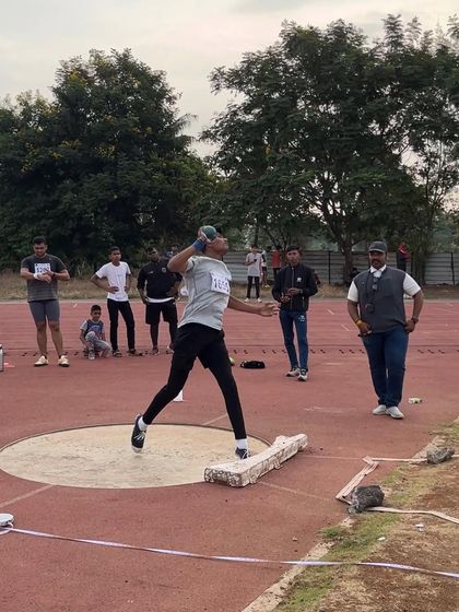 A shot putter in action, reflecting the effort and training that goes into every performance.