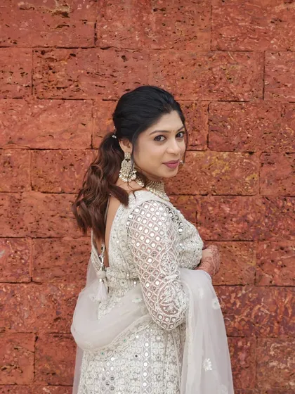 A beautiful portrait of the wedding guest, her makeup looking flawless and natural.