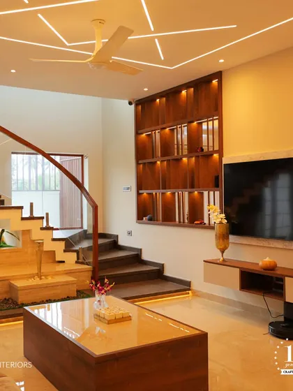 A home should be a perfect blend of elegance and ease. This living room showcases how we integrate different levels, lighting, and materials like wood and marble to create a space that is functional, beautiful, and timeless.
