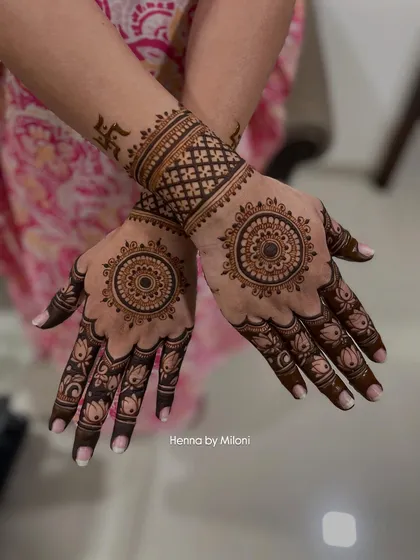 A simple yet powerful design with mandalas on the palms and a Swastika on the wrist, a sacred symbol of good fortune.