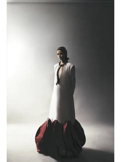 A full-length view of the sculptural dress from the Sigma test shoot. This demonstrates how the 30mm focal length works for capturing both the garment and the model's presence.