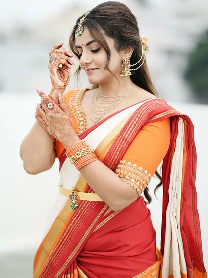 A beautiful portrait of Namratha Gowda, where her simple and elegant mehendi adds a touch of tradition to her modern look.