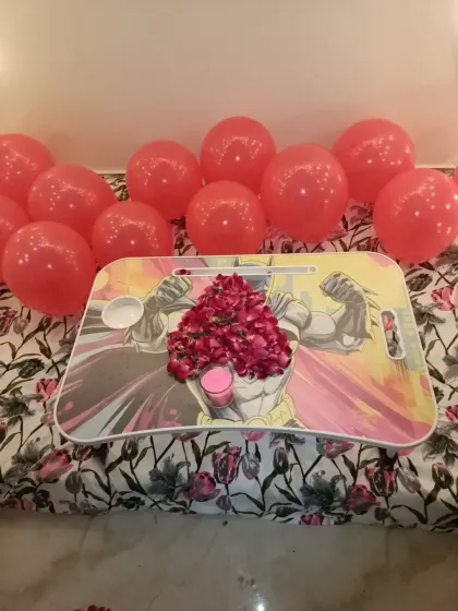 A close-up of the small table inside the cabana, decorated with a heart made of fresh rose petals. It's these small details that make the surprise special.