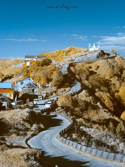 A glimpse into an unseen world from Singalila National Park, shot with a converted infrared camera. This technique transforms the landscape, turning foliage golden and skies a deep, surreal blue.