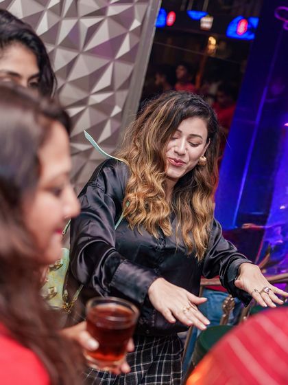 A guest lost in the music on the dance floor.