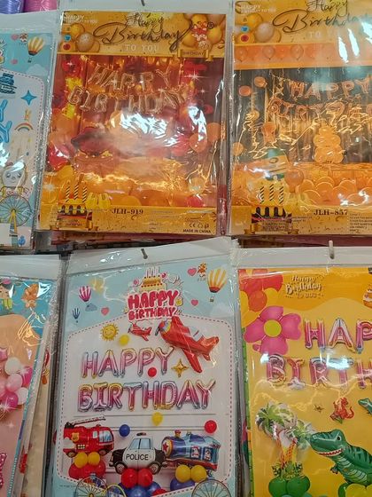 A snapshot of the different birthday balloon kits available on our shelves. You can see multiple themes packed and ready to go, highlighting the convenience of finding a complete decoration solution in one place.