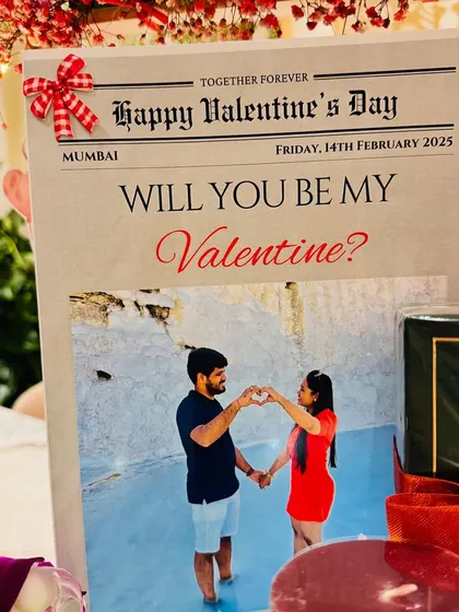 The custom Valentine's newspaper, featuring the couple's photo, is the headline of this romantic gift.