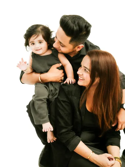 A happy family of three. Their smiles and interactions show the deep love and connection they share.