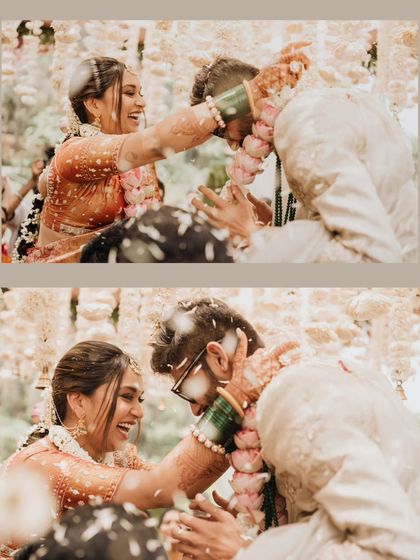 A playful moment during the wedding rituals, where the bride and groom are having fun and sharing a laugh.