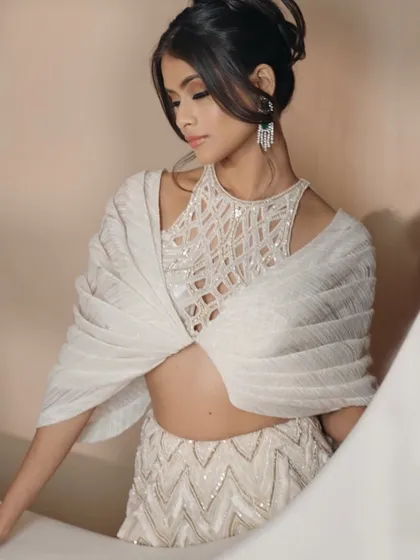 A closer look at the embellished bodice of the ivory cocktail lehenga, designed for the bride who seeks sophistication and charm.