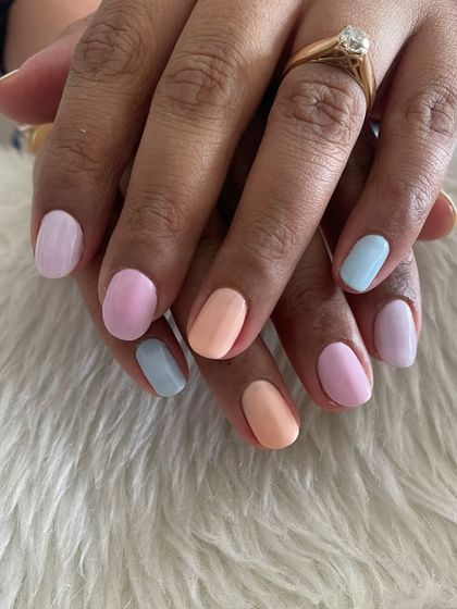 A fun pastel skittle manicure, with each nail painted a different soft shade.