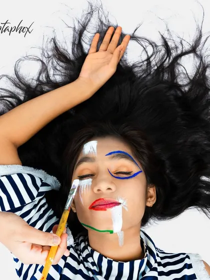 For clients with a bold vision, I create high-fashion editorial images like this one. This overhead shot uses creative makeup and composition to produce a striking, art-focused photograph that stands out.