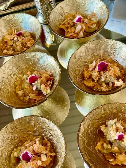 A serving of Pomegranate Raita, a cooling and refreshing accompaniment to our spicy and flavourful Indian main courses.