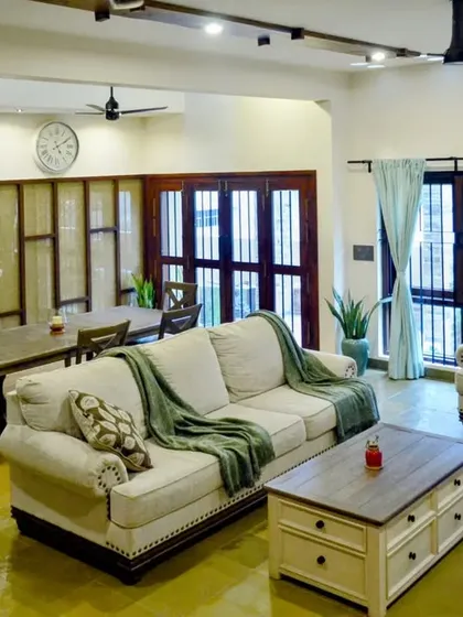 A home truly comes to life when it's lived in. This view of the 'Mountain Abode' living room, complete with the family's beloved pets, shows how a well-designed space becomes a comfortable, cherished backdrop for everyday life.