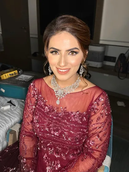 This engagement bride looks absolutely radiant with her filter-free makeup. The focus is on clean, glowing skin and eyes that are defined but not heavy, perfect for her evening celebration.