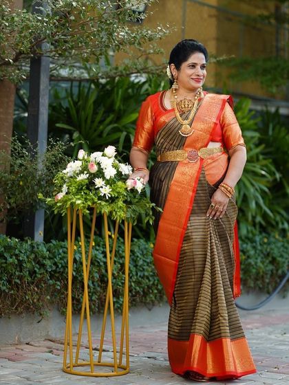 Shilpa owning her look, the rich colors of the saree complemented by her traditional gold jewelry.