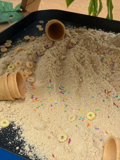 This taste-safe "ice cream" sand, made from flour and decorated with sprinkles, was part of our Gruffalo party. It's perfect for scooping into cones and cupcake liners, encouraging imaginative play.