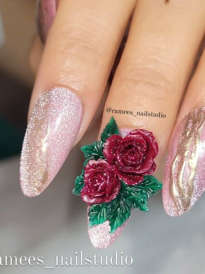 A close-up showing the fine details of the sculpted red roses. You can see the texture of each petal, making the flowers look incredibly lifelike.
