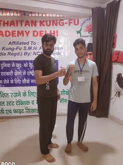 A moment of respect between teacher and student. Here I am with one of my dedicated fighters after a successful training session at the academy.