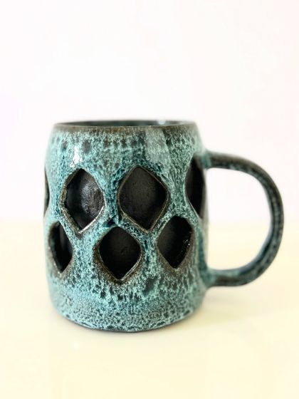 A different perspective on the geometric mug, showing its clean lines and sturdy form. It’s a great example of how a functional item can also be a piece of art.
