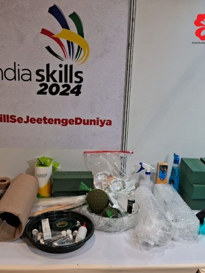 The workstation for an IndiaSkills competitor, fully stocked with floral foam, sprays, and tools. We ensure our students are familiar with all professional-grade equipment.
