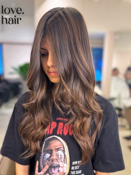 A portrait shot of our 'golden brown' balayage, showing how the colour and cut frame the face beautifully.