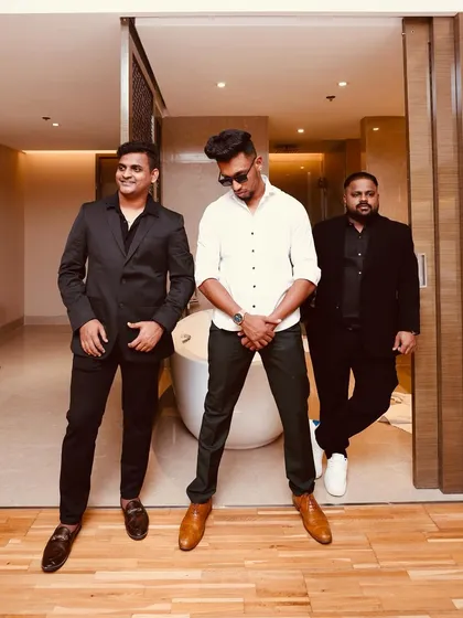 A candid moment with the team before we kick off a Sangeet night. We're relaxed, prepared, and excited to bring the energy.