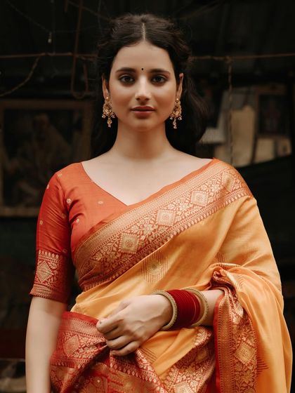 A close-up portrait of the model, her calm and steady gaze creating a powerful and captivating image.