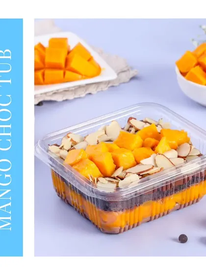 A delightful combination of flavors in our Mango Chocolate Tub. This dessert layers rich chocolate sponge and chocolate ganache with chunks of fresh mango, all topped with crunchy almonds.