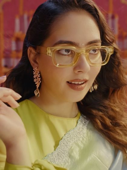 A quirky and modern look from the Kushal's Jewellery ad. The makeup is clean and fresh, allowing the unique glasses and statement earrings to shine.
