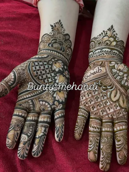 A beautiful back-hand design with a mix of bold and fine lines, featuring a peacock and the name 'Suhaib'.