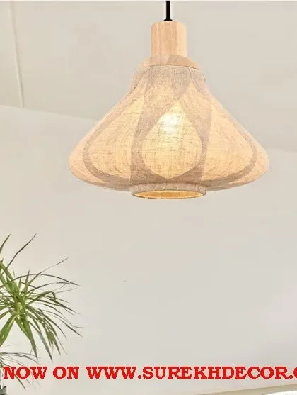 This wood-made hanging light features a unique, patterned fabric shade that casts a beautiful, diffused light. The antique wooden finish adds to its rustic and handcrafted appeal.