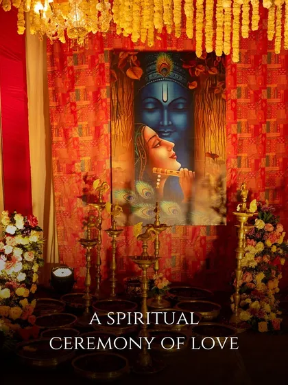 A sacred corner of the event, featuring a beautiful painting of Radha and Krishna, surrounded by traditional diyas and floral arrangements, setting a spiritual tone.