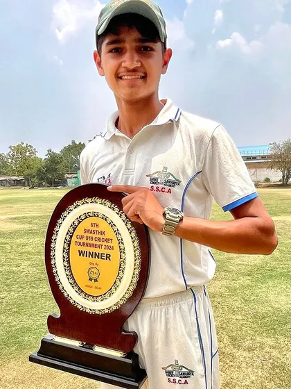 Preet Malik proudly displaying his winner's shield.