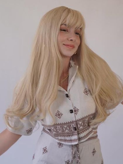 A 50-inch long blonde wig with bangs, made with HD lace. This is a statement piece for anyone wanting to make a bold impression.