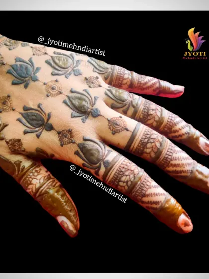 A unique and modern design featuring spaced-out lotus motifs on the back of the hand. This is a great choice for a minimalist bride.