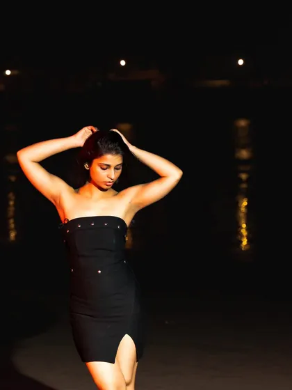 An expressive pose that feels both strong and vulnerable, captured with a simple and effective flash setup.