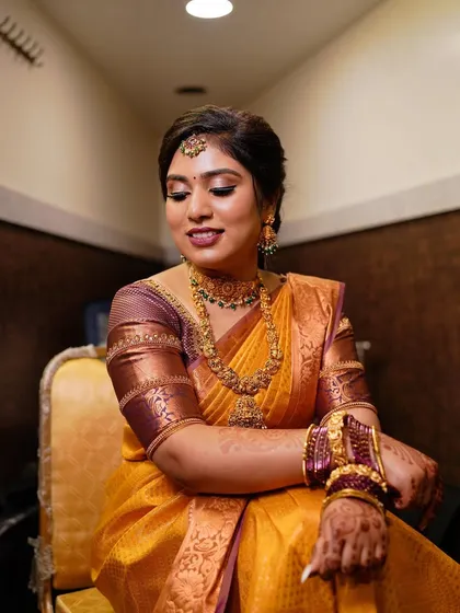 A seated portrait of the client. The makeup is flawless and enhances her features, making her feel confident and beautiful.